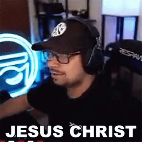 Man Wearing Headphones and Hat Saying Jesus Christ