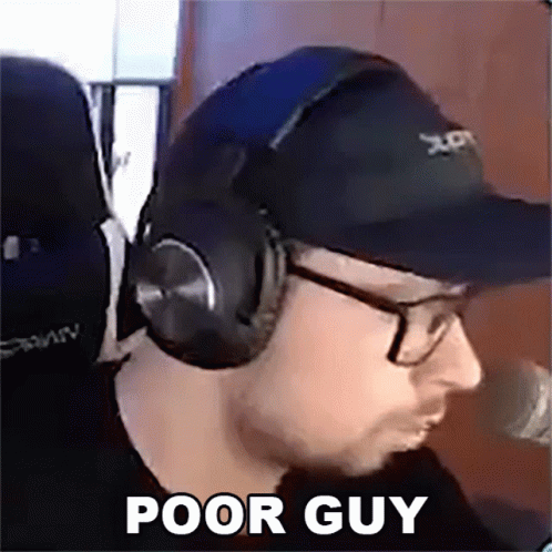Man Wearing Headphones and Hat Sitting