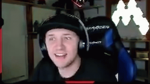 Man Wearing Headphones And Hat Sitting In Chair GIF