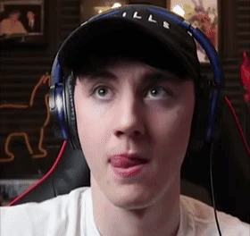 Man Wearing Headphones And Hat Sticking Out Tongue GIF