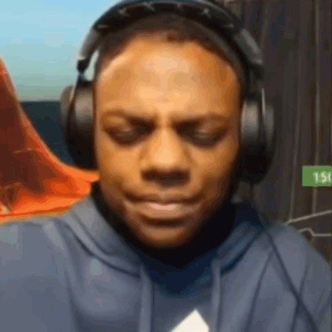 Man Wearing Headphones and Hoodie