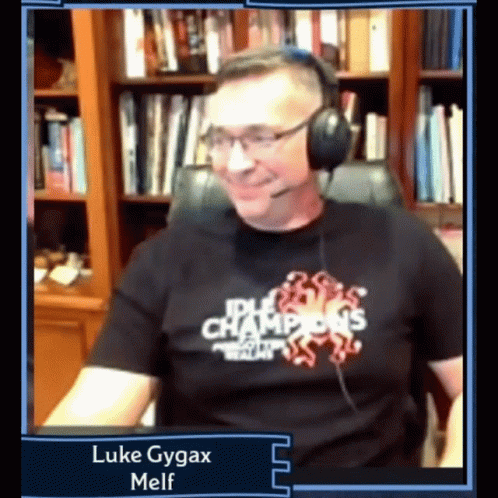 Man Wearing Headphones and Idle Champions T-Shirt