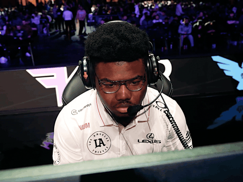 Man Wearing Headphones and Lexus Shirt