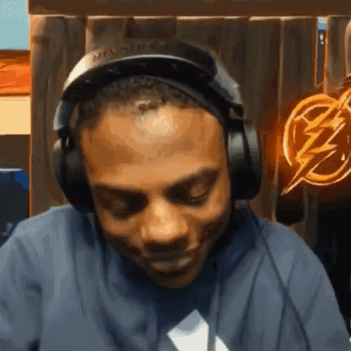 Man Wearing Headphones And Lightning Bolt Shirt GIF