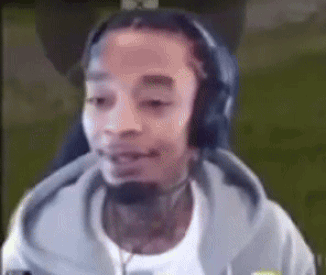 Man Wearing Headphones and Microphone Smiling