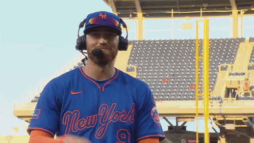 Man Wearing Headphones and New York Baseball Jersey
