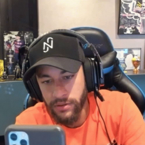 Man Wearing Headphones and NZ Hat