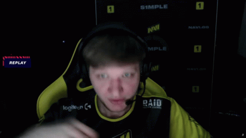 Man Wearing Headphones and Paid Shirt