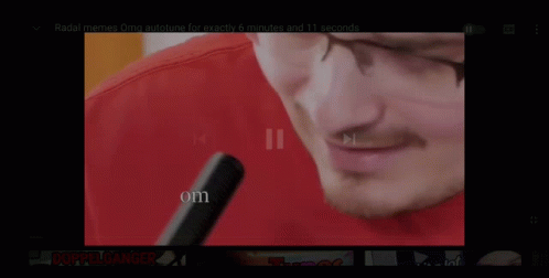 Man Wearing Headphones and Red Puma Shirt Playing Flute