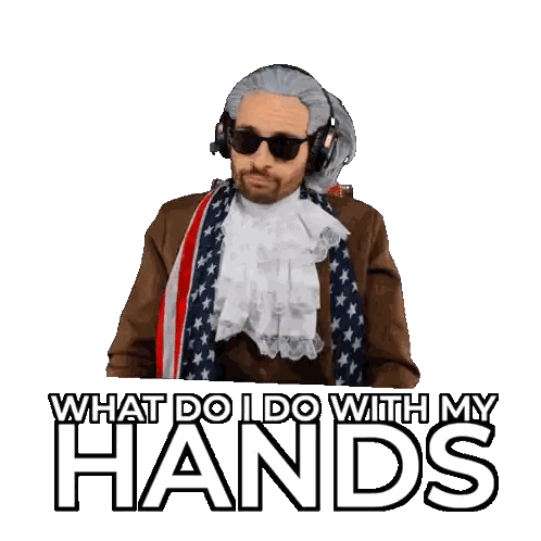 Man Wearing Headphones and Scarf Saying What Do I Do With My Hands