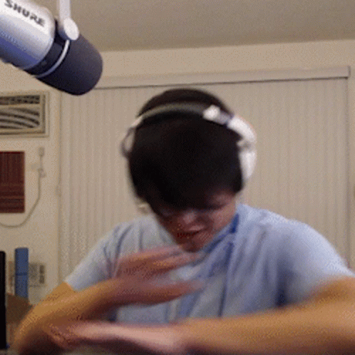 Man Wearing Headphones And Shure Microphone GIF