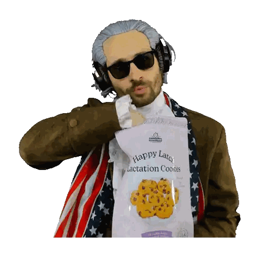 Man Wearing Headphones and Sunglasses Holding Cookies Bag