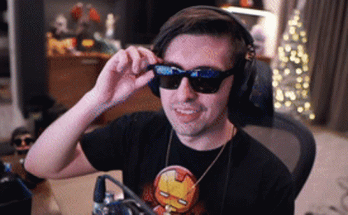 Man Wearing Headphones And Sunglasses In Iron Man Shirt GIF