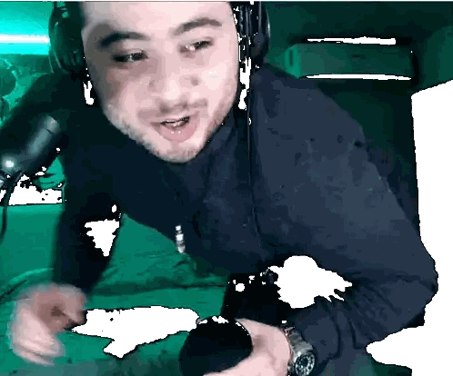 Man Wearing Headphones and Watch Holding Microphone