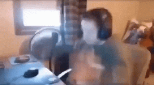 Man Wearing Headphones At Desk GIF