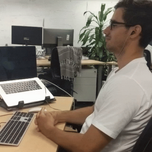 Man Wearing Headphones at Desk