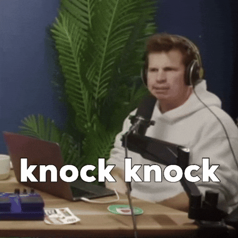 Man Wearing Headphones at Microphone with Knock Knock