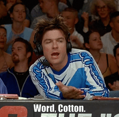 Man Wearing Headphones Before Word Cotton Sign