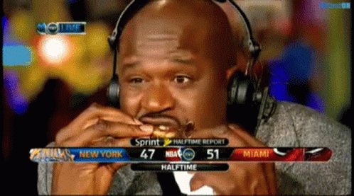 Man Wearing Headphones Eating Hamburger Sprint Halftime Report