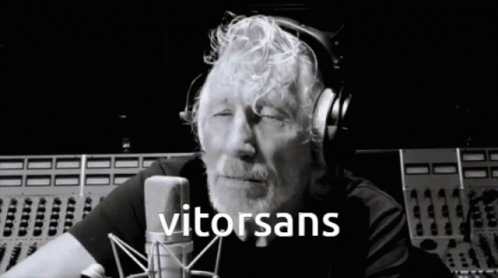 Man Wearing Headphones In Front Of Microphone GIF