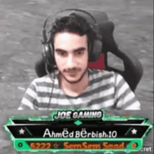 Man Wearing Headphones in Front of Screen Saying Joe Gaming Ahmed Berbish 10
