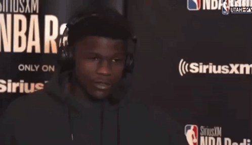 Man Wearing Headphones In Front Of Sirius XM GIF