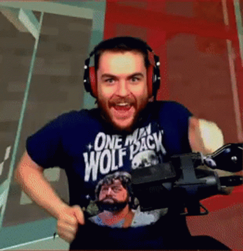 Man Wearing Headphones in One Man Wolf Pack Shirt