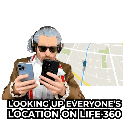 Man Wearing Headphones Looking at Phone