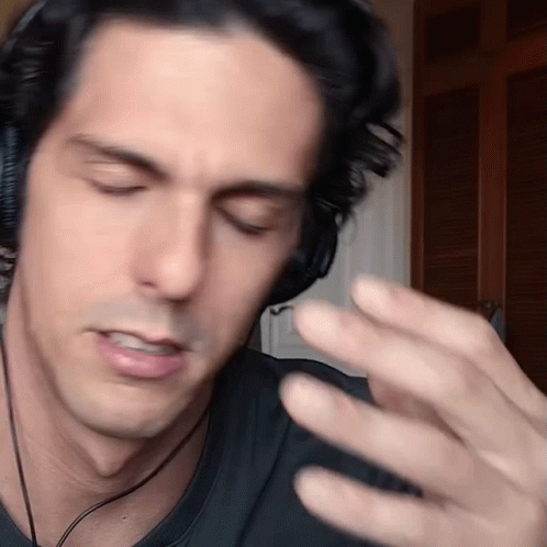 Man Wearing Headphones Making Funny Face