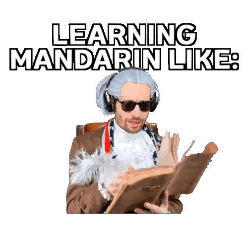 Man Wearing Headphones Reading Book Learning Mandarin