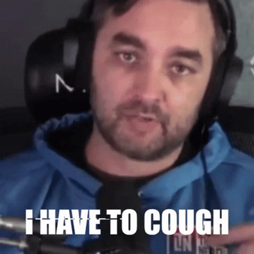 Man Wearing Headphones Saying I Have To Cough