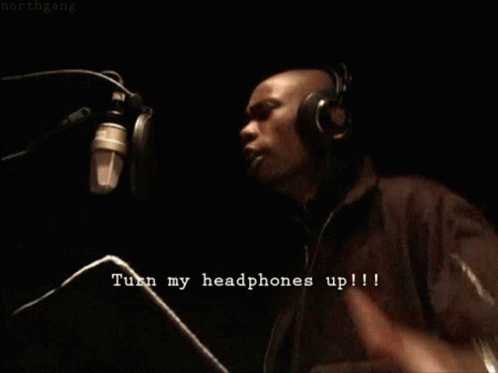 Man Wearing Headphones Saying Turn My Headphones Up