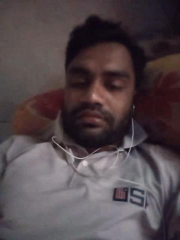 Man Wearing Headphones Saying US