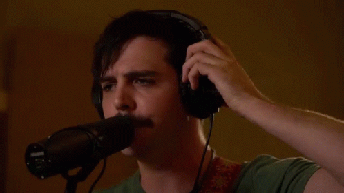 Man Wearing Headphones Singing Into Microphone GIF