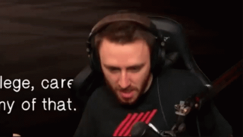 Man Wearing Headphones Sitting in Chair