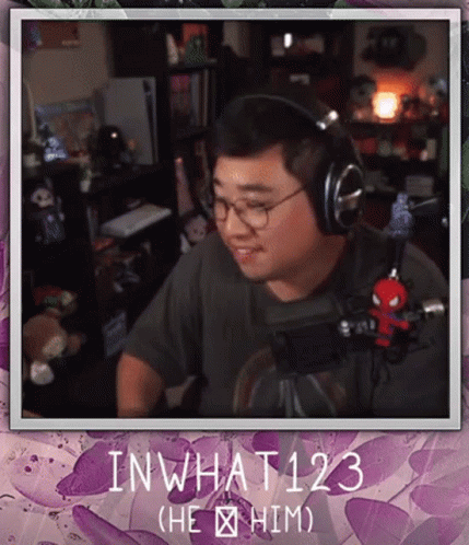 Man Wearing Headphones Sitting in Front of Microphone inwhat123