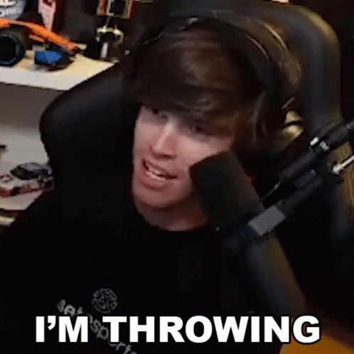 Man Wearing Headphones Sitting in Front of Microphone Saying I'm Throwing