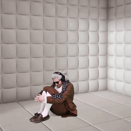 Man Wearing Headphones Sitting On Floor GIF