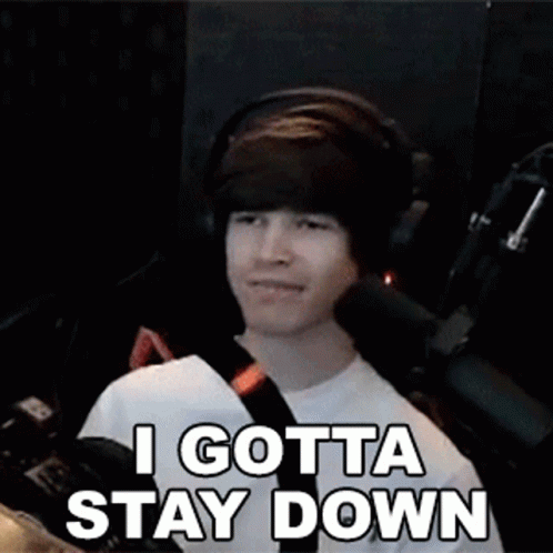 Man Wearing Headphones Smiling and Saying I Gotta Stay Down