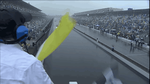 Man Wearing Headphones Watching Race GIF