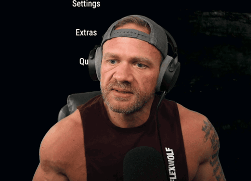 Man Wearing Headphones With Settings Extras Quit