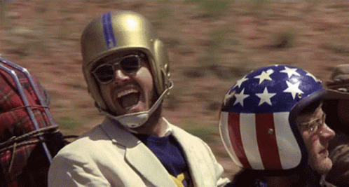 Man Wearing Helmet and Sunglasses Laughing