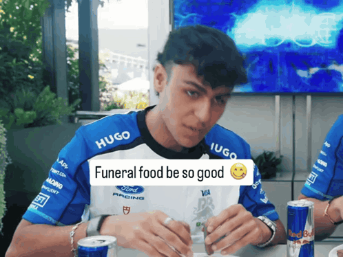 Man Wearing Hugo Shirt Eating GIF