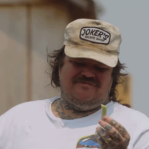 Man Wearing Joker's Skate Shop Hat