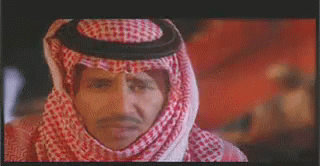 Man Wearing Keffiyeh and Hat
