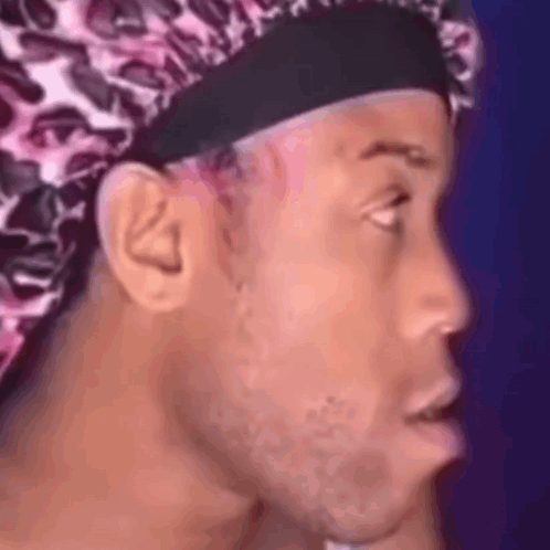 Man Wearing Leopard Print Hat Making Funny Face