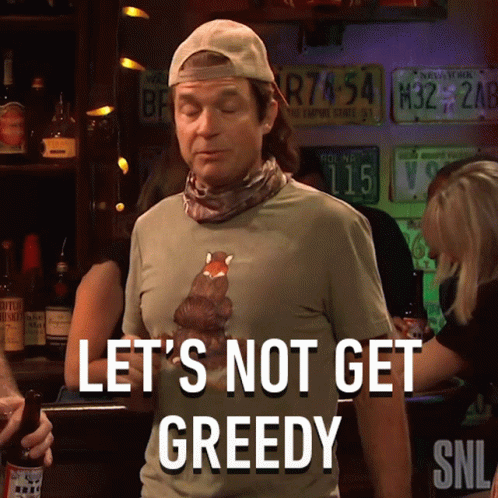 Man Wearing Lets Not Get Greedy Shirt