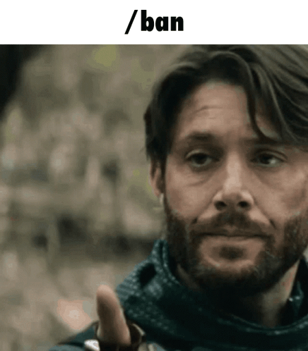 Man Wearing Mask Looks at Camera