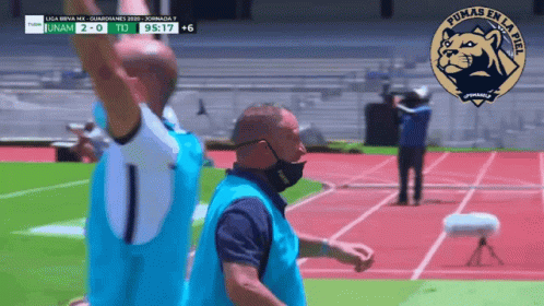 Man Wearing Mask on Track with Pumas Logo