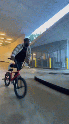 Man Wearing Mask Riding Red Bike